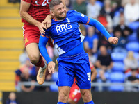 Adam Crowther of Southend United Football Club tussles with James Norwood of Oldham Athletic Association Football Club during the Vanarama N...