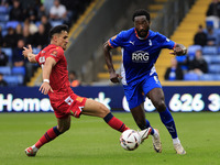 Emmanuel Monthe of Oldham Athletic Association Football Club tussles with Noor Husin of Southend United Football Club during the Vanarama Na...