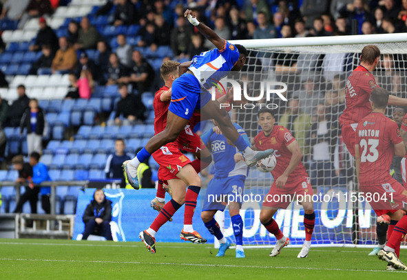 Mike Fondop of Oldham Athletic Association Football Club heads for goal during the Vanarama National League match between Oldham Athletic an...