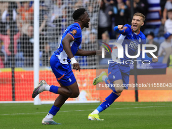 Mike Fondop of Oldham Athletic Association Football Club celebrates scoring his side's first goal of the game during the Vanarama National L...