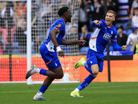 Mike Fondop of Oldham Athletic Association Football Club celebrates scoring his side's first goal of the game during the Vanarama National L...