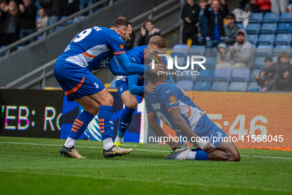 Mike Fondop of Oldham Athletic celebrates scoring his side's equalizer during the Vanarama National League match between Oldham Athletic and...