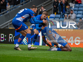 Mike Fondop of Oldham Athletic celebrates scoring his side's equalizer during the Vanarama National League match between Oldham Athletic and...