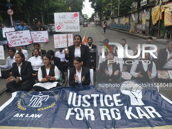 Law students give slogans protesting over the sexual assault and murder of a postgraduate woman doctor in Kolkata, India, on September 8, 20...