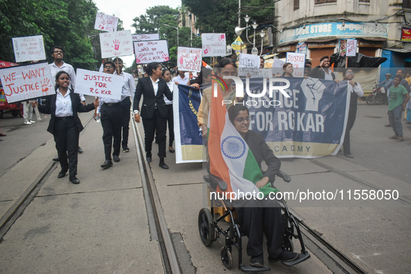 Law students give slogans protesting over the sexual assault and murder of a postgraduate woman doctor in Kolkata, India, on September 8, 20...