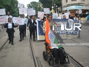 Law students give slogans protesting over the sexual assault and murder of a postgraduate woman doctor in Kolkata, India, on September 8, 20...