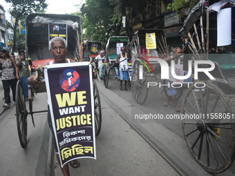 Hand-pulled rickshaw drivers protest over the sexual assault and murder of a postgraduate woman doctor in Kolkata, India, on September 8, 20...