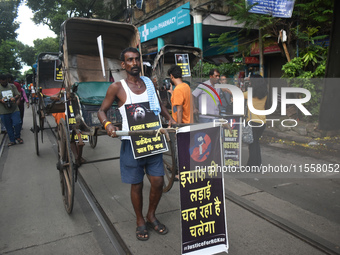 Hand-pulled rickshaw drivers protest over the sexual assault and murder of a postgraduate woman doctor in Kolkata, India, on September 8, 20...