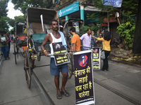 Hand-pulled rickshaw drivers protest over the sexual assault and murder of a postgraduate woman doctor in Kolkata, India, on September 8, 20...