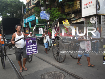 Hand-pulled rickshaw drivers protest over the sexual assault and murder of a postgraduate woman doctor in Kolkata, India, on September 8, 20...