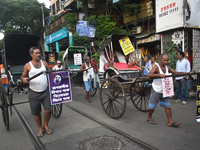 Hand-pulled rickshaw drivers protest over the sexual assault and murder of a postgraduate woman doctor in Kolkata, India, on September 8, 20...