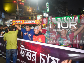 Supporters of East Bengal and Mohan Bagan club protest over the sexual assault and murder of a postgraduate woman doctor in Kolkata, India,...