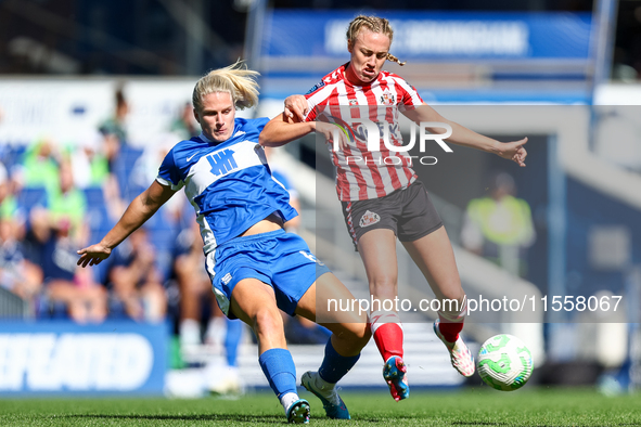 #6, Gemma Lawley of Birmingham, battles for possession with #9, Eleanor Dale of Sunderland during the FA Women's Championship match between...