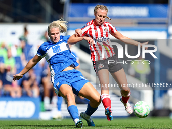 #6, Gemma Lawley of Birmingham, battles for possession with #9, Eleanor Dale of Sunderland during the FA Women's Championship match between...