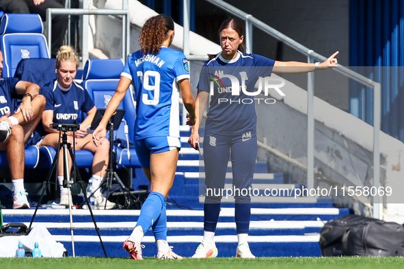 Amy Merricks, manager of Birmingham City, gestures as she is approached by #19, Tegan McGowan, during the FA Women's Championship match betw...