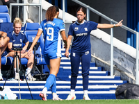 Amy Merricks, manager of Birmingham City, gestures as she is approached by #19, Tegan McGowan, during the FA Women's Championship match betw...