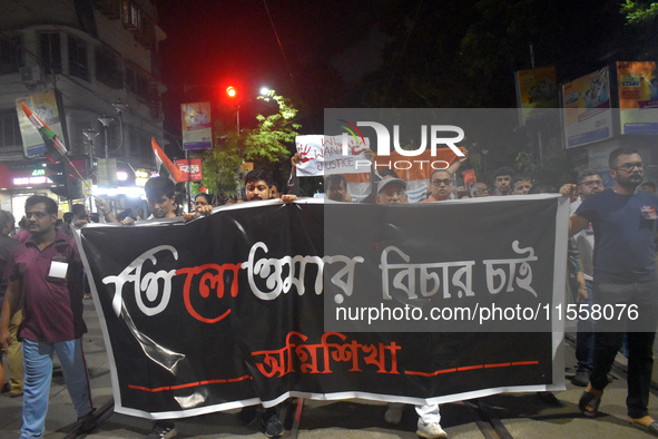 People protest over the sexual assault and murder of a postgraduate woman doctor in Kolkata, India, on September 8, 2024. 