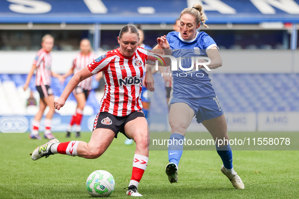 Amy Goddard of Sunderland is pressured by Rebecca Holloway of Birmingham during the FA Women's Championship match between Birmingham City an...