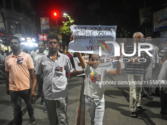 People protest over the sexual assault and murder of a postgraduate woman doctor in Kolkata, India, on September 8, 2024. (