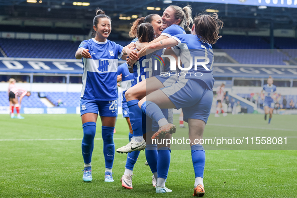 #13, Ivana Fuso of Birmingham is mobbed by teammates as they celebrate her goal, making it 5-0 during the FA Women's Championship match betw...