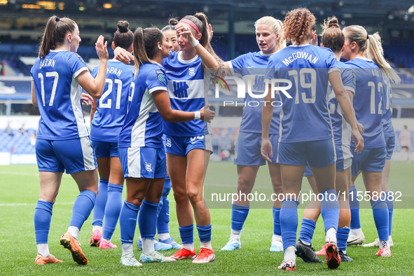 #13, Ivana Fuso of Birmingham, is congratulated by #30, Neve Herron (center hand raised) during the FA Women's Championship match between Bi...