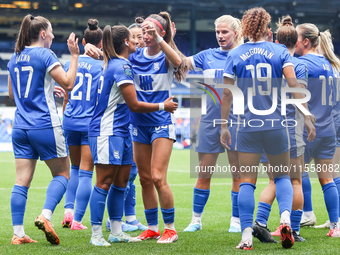 #13, Ivana Fuso of Birmingham, is congratulated by #30, Neve Herron (center hand raised) during the FA Women's Championship match between Bi...