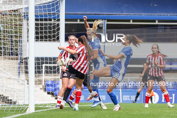 Libby Smith of Birmingham (partially obscured) attempts to head at goal during the FA Women's Championship match between Birmingham City and...