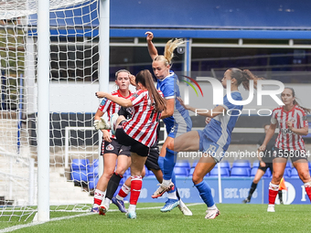 Libby Smith of Birmingham (partially obscured) attempts to head at goal during the FA Women's Championship match between Birmingham City and...