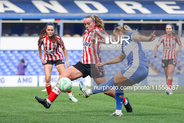 #23, Charlie Devlin of Birmingham, attacks as #11, Jessica Brown of Sunderland, moves to intercept during the FA Women's Championship match...