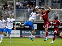 Barrow's Kian Spence challenges for a header with Swindon Town's Daniel Butterworth during the Sky Bet League 2 match between Barrow and Swi...