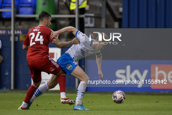 Rory Feely of Barrow battles for possession with Grant Hall of Swindon Town during the Sky Bet League 2 match between Barrow and Swindon Tow...