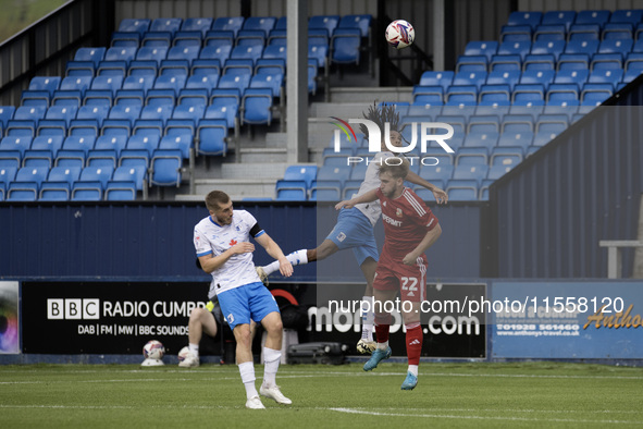 Barrow's Neo Eccleston challenges for a header with Swindon's Daniel Butterworth during the Sky Bet League 2 match between Barrow and Swindo...