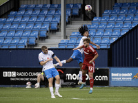 Barrow's Neo Eccleston challenges for a header with Swindon's Daniel Butterworth during the Sky Bet League 2 match between Barrow and Swindo...