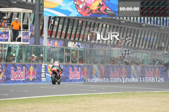 Ogura Ai wins under the finish flag during the Gran Premio Red Bull di San Marino e della Riviera di Rimini Grand Prix Race MotoGP on Sunday...