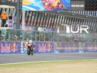 Ogura Ai wins under the finish flag during the Gran Premio Red Bull di San Marino e della Riviera di Rimini Grand Prix Race MotoGP on Sunday...