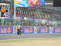 Ogura Ai wins under the finish flag during the Gran Premio Red Bull di San Marino e della Riviera di Rimini Grand Prix Race MotoGP on Sunday...