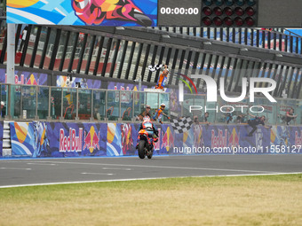 Ogura Ai wins under the finish flag during the Gran Premio Red Bull di San Marino e della Riviera di Rimini Grand Prix Race MotoGP on Sunday...