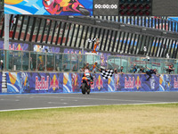 Ogura Ai wins under the finish flag during the Gran Premio Red Bull di San Marino e della Riviera di Rimini Grand Prix Race MotoGP on Sunday...