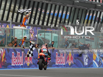 Ogura Ai wins under the finish flag during the Gran Premio Red Bull di San Marino e della Riviera di Rimini Grand Prix Race MotoGP on Sunday...