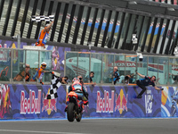 Ogura Ai wins under the finish flag during the Gran Premio Red Bull di San Marino e della Riviera di Rimini Grand Prix Race MotoGP on Sunday...