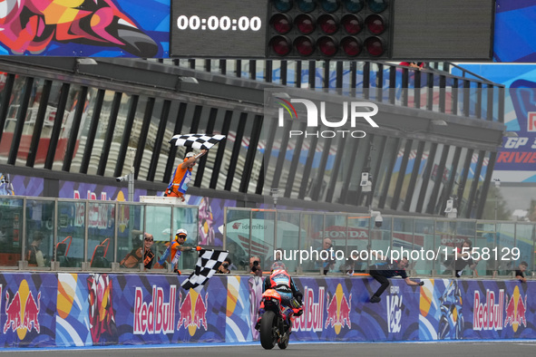 Ogura Ai wins under the finish flag during the Gran Premio Red Bull di San Marino e della Riviera di Rimini Grand Prix Race MotoGP on Sunday...