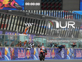 Ogura Ai wins under the finish flag during the Gran Premio Red Bull di San Marino e della Riviera di Rimini Grand Prix Race MotoGP on Sunday...