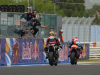 Ogura Ai wins under the finish flag during the Gran Premio Red Bull di San Marino e della Riviera di Rimini Grand Prix Race MotoGP on Sunday...