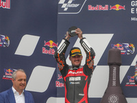 Canet Aron stands on the podium during the Gran Premio Red Bull di San Marino e della Riviera di Rimini Grand Prix Race MotoGP on Sunday at...