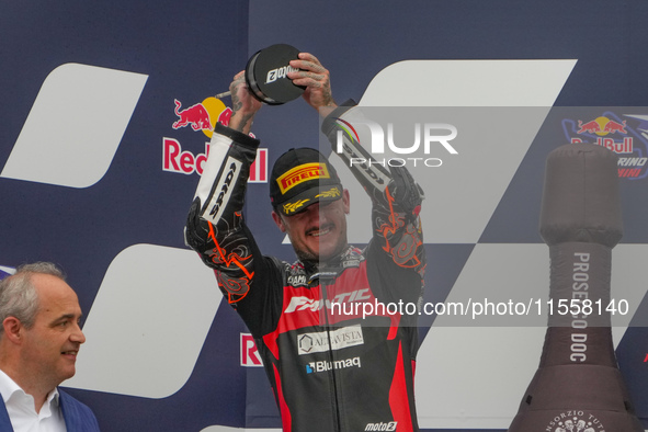 Canet Aron stands on the podium during the Gran Premio Red Bull di San Marino e della Riviera di Rimini Grand Prix Race MotoGP on Sunday at...