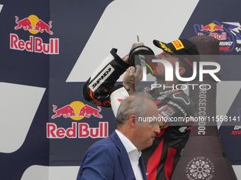 Canet Aron stands on the podium during the Gran Premio Red Bull di San Marino e della Riviera di Rimini Grand Prix Race MotoGP on Sunday at...