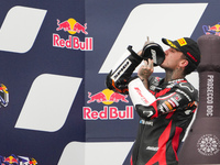 Canet Aron stands on the podium during the Gran Premio Red Bull di San Marino e della Riviera di Rimini Grand Prix Race MotoGP on Sunday at...