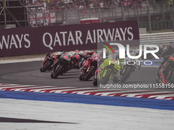 Marc Marquez and Marco Bezzecchi participate in the Gran Premio Red Bull di San Marino e della Riviera di Rimini Grand Prix Race MotoGP on S...