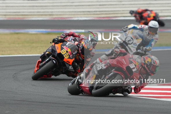 Pedro Acosta and Brad Binder participate in the Gran Premio Red Bull di San Marino e della Riviera di Rimini Grand Prix Race MotoGP on Sunda...