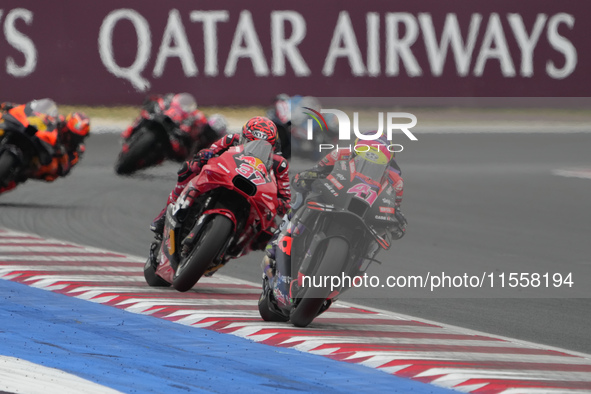 Aleix Espargaro and Augusto Fernandez participate in the Gran Premio Red Bull di San Marino e della Riviera di Rimini Grand Prix Race MotoGP...